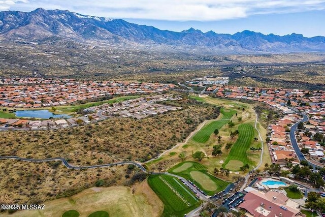 bird's eye view with golf course view and a mountain view