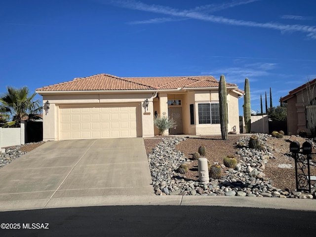 view of front of house featuring stucco siding, concrete driveway, an attached garage, fence, and a tiled roof