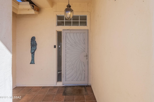 property entrance featuring stucco siding