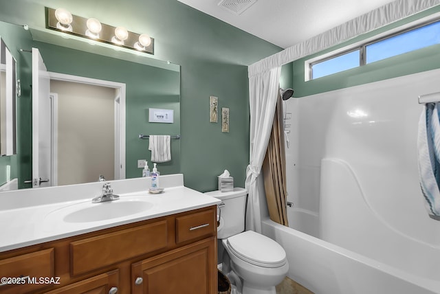 full bathroom featuring vanity, toilet, and shower / bath combo with shower curtain