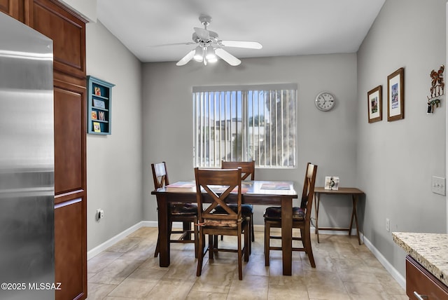 dining space featuring ceiling fan and light tile patterned flooring