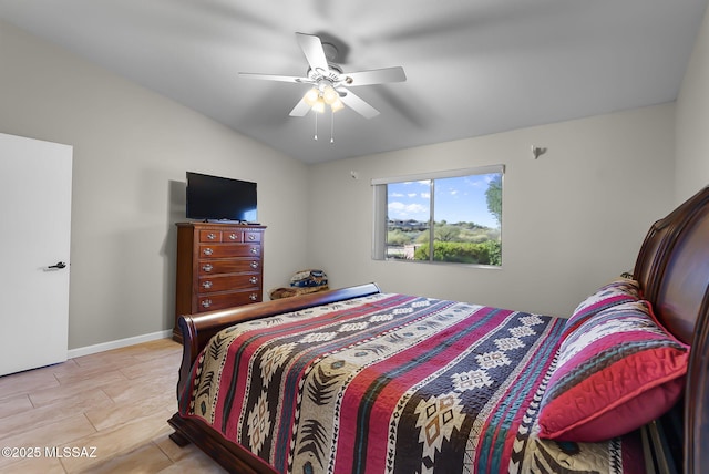 bedroom with light hardwood / wood-style floors, vaulted ceiling, and ceiling fan