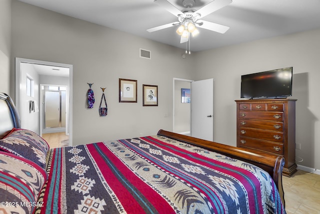 bedroom featuring ceiling fan and ensuite bathroom