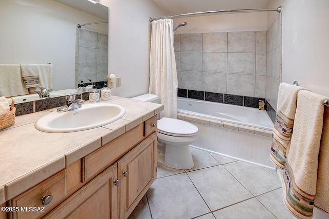 full bathroom featuring toilet, shower / bath combo, vanity, and tile patterned floors