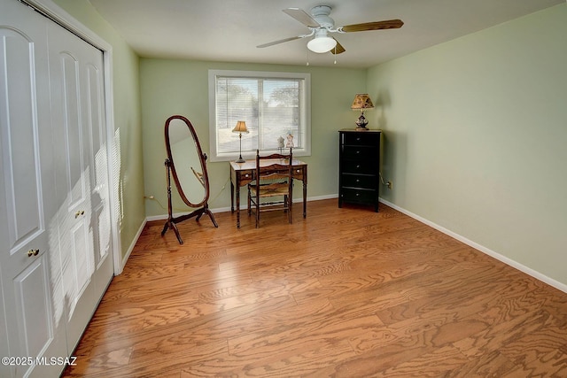 sitting room with ceiling fan and light hardwood / wood-style floors