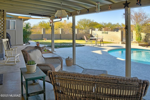 view of patio featuring a fenced in pool