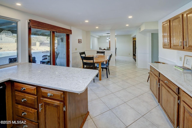 kitchen with light stone countertops and light tile patterned flooring