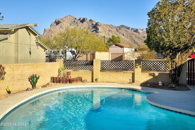 view of pool with a mountain view