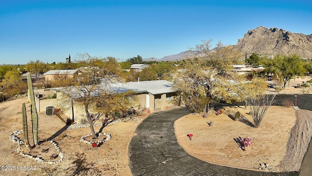 exterior space featuring cooling unit and a mountain view