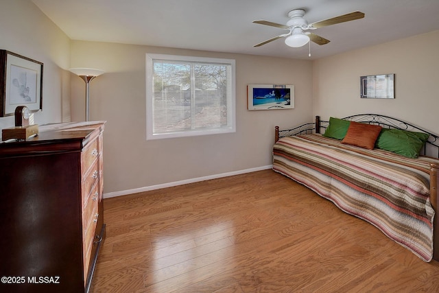 bedroom with ceiling fan and light hardwood / wood-style flooring