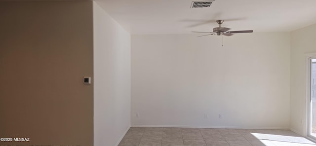 unfurnished room with ceiling fan and a healthy amount of sunlight