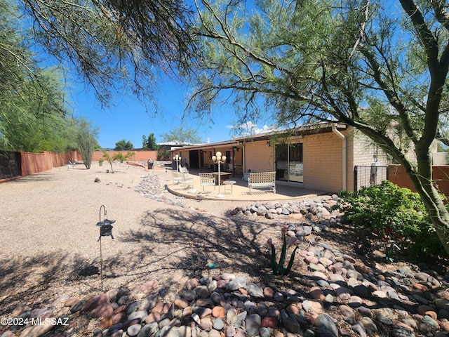 rear view of house featuring a patio area