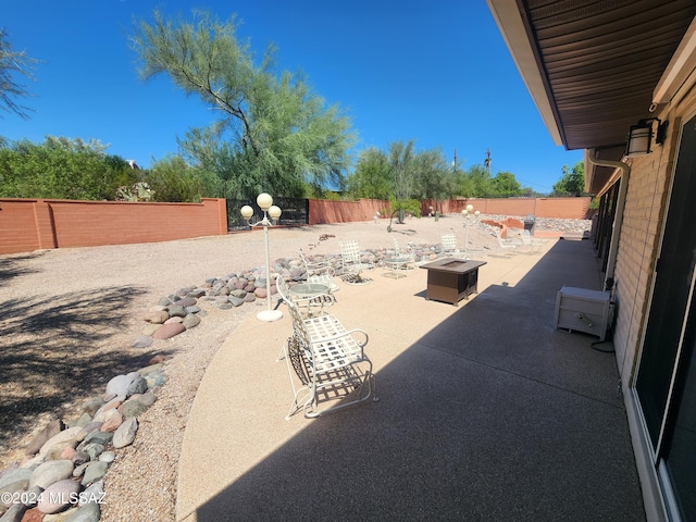 view of patio featuring an outdoor fire pit