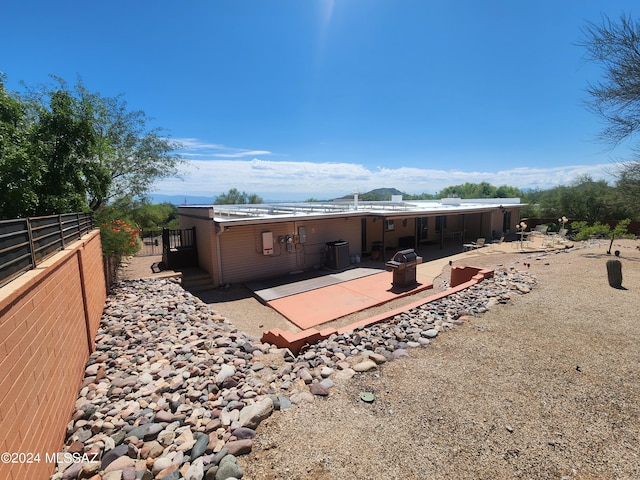 back of house with a patio