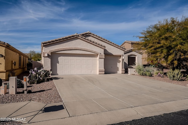 mediterranean / spanish-style home featuring a garage