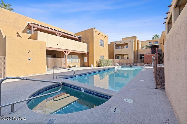 view of pool featuring a community hot tub