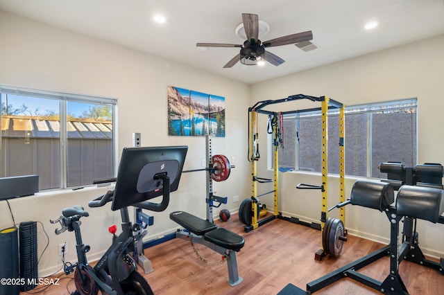 workout room with ceiling fan, recessed lighting, wood finished floors, and baseboards