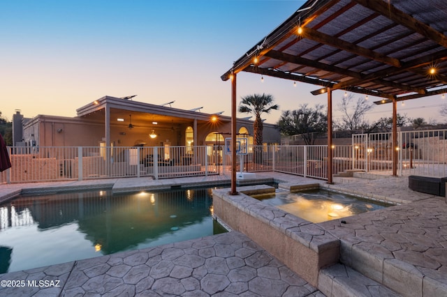 view of swimming pool with a fenced in pool, a patio area, fence, a pergola, and an in ground hot tub