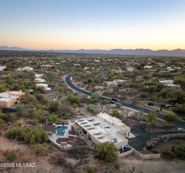 aerial view at dusk with a mountain view