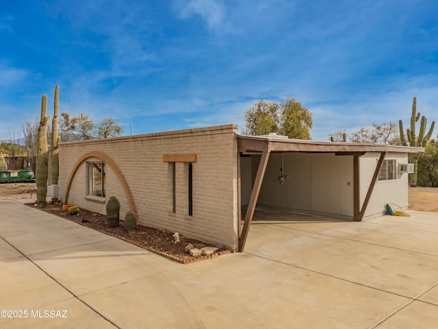 exterior space with a carport