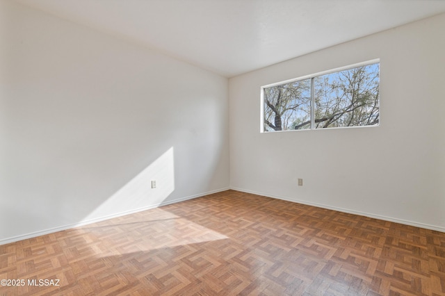 unfurnished room with parquet floors