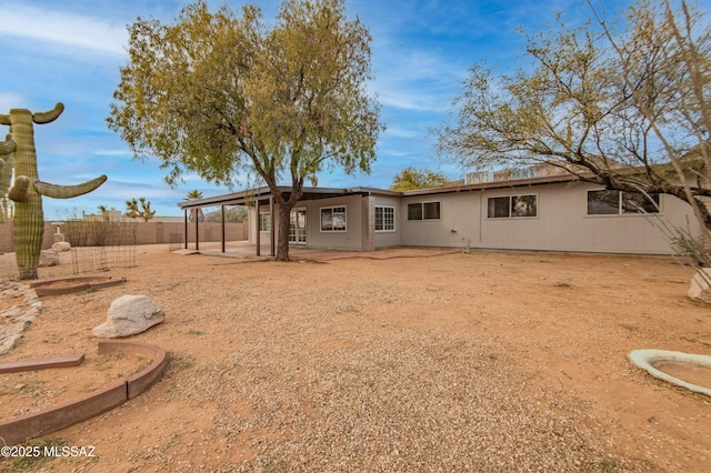 rear view of property featuring a patio area