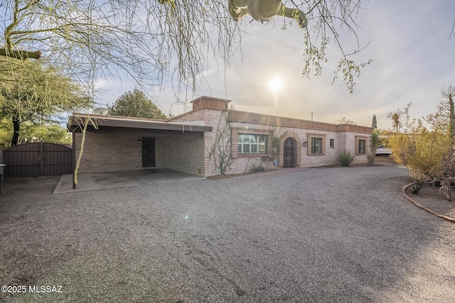 view of front of property featuring a carport