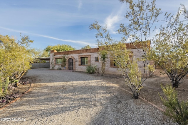 ranch-style house with a carport