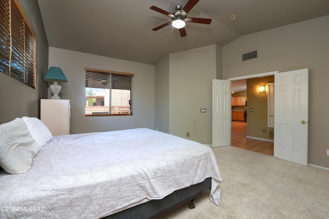 carpeted bedroom featuring ceiling fan and lofted ceiling