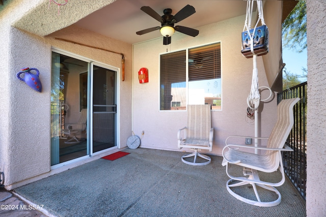 view of patio featuring ceiling fan