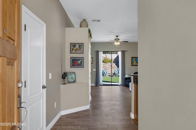 corridor with dark wood-type flooring