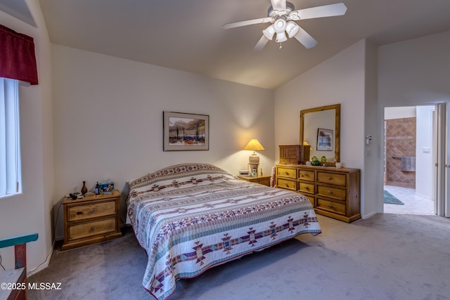 carpeted bedroom with lofted ceiling, connected bathroom, and ceiling fan