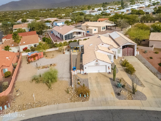 birds eye view of property with a mountain view