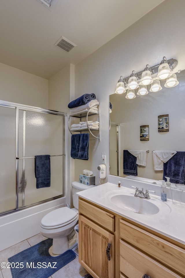 full bathroom with toilet, tile patterned flooring, combined bath / shower with glass door, and vanity