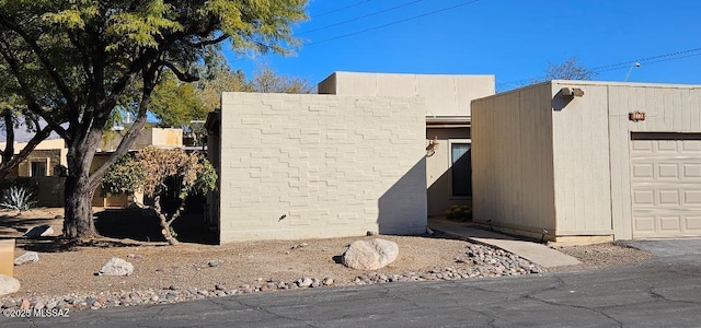 view of side of property featuring a garage