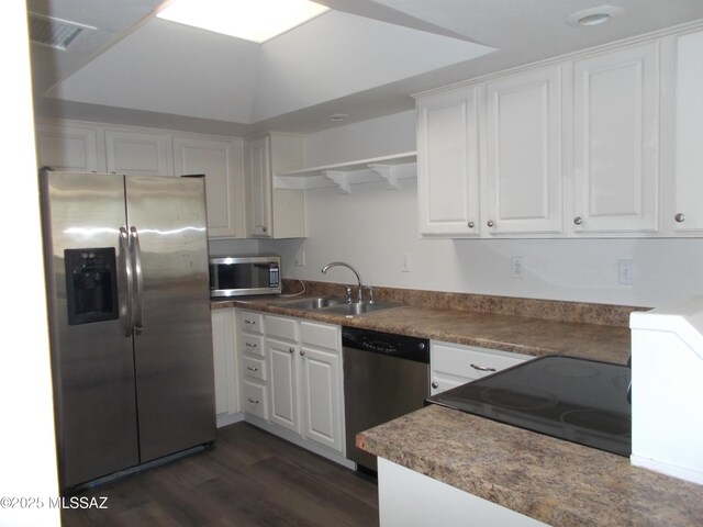 kitchen with electric range, white cabinets, a textured ceiling, and dark wood-type flooring