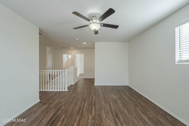 unfurnished room with dark wood-type flooring