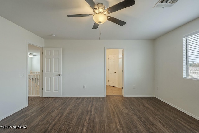 unfurnished bedroom with dark hardwood / wood-style floors and ceiling fan