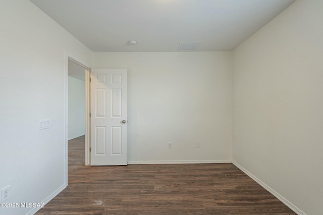 empty room featuring dark hardwood / wood-style floors