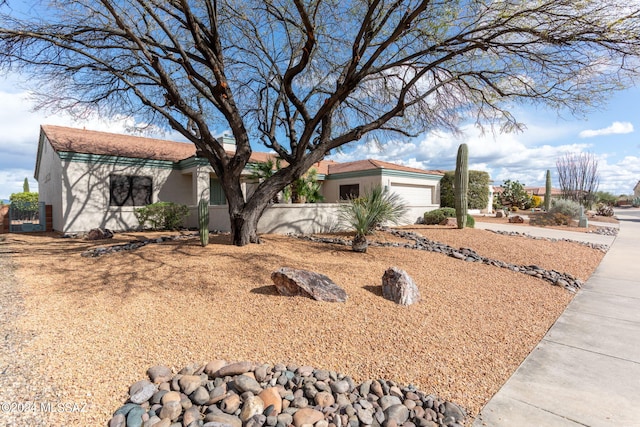 ranch-style house featuring a garage