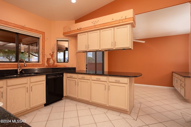 kitchen with kitchen peninsula, vaulted ceiling, sink, dark stone countertops, and black dishwasher