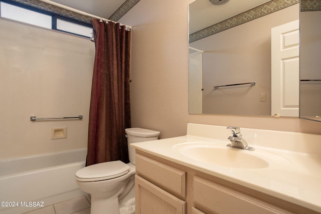 full bathroom featuring tile patterned flooring, vanity, toilet, and shower / bath combo with shower curtain