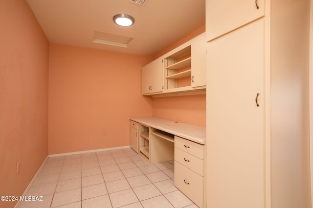 unfurnished office featuring light tile patterned flooring