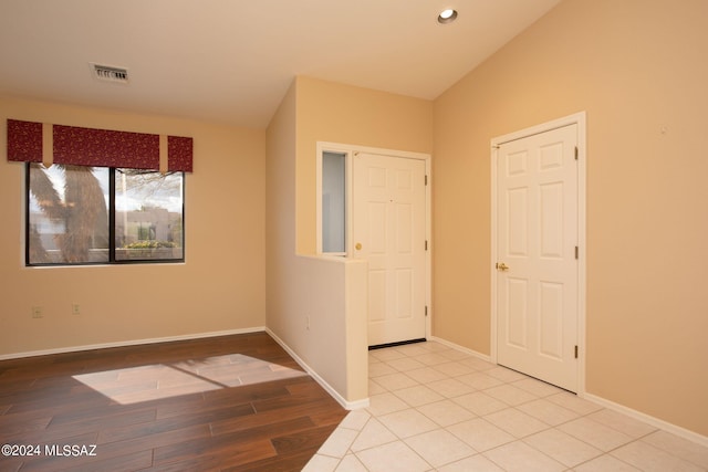 empty room with light hardwood / wood-style floors