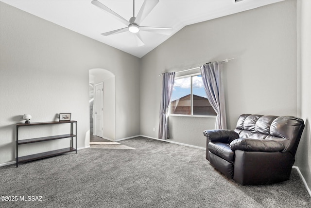 sitting room with carpet, vaulted ceiling, and ceiling fan