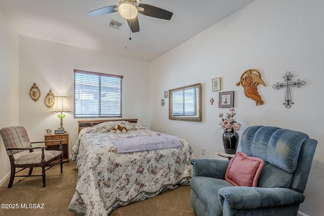 bedroom featuring light carpet and ceiling fan