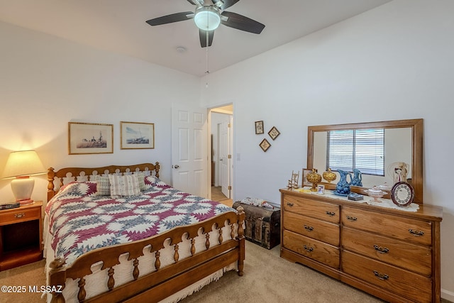 bedroom with ceiling fan and light colored carpet