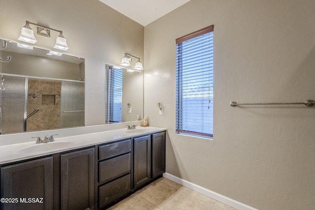 bathroom featuring a shower, tile patterned flooring, and vanity