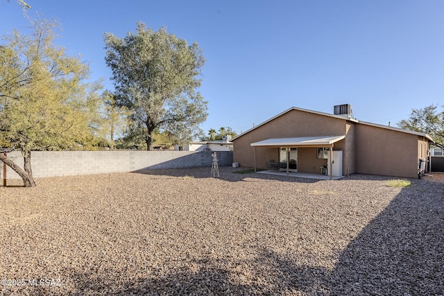 rear view of property featuring a patio