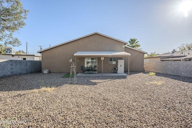 back of house with a patio area